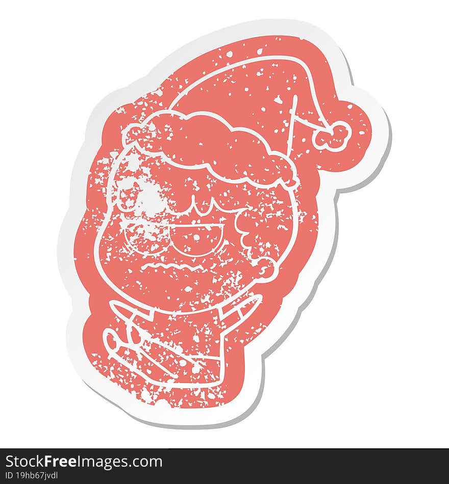 Cartoon Distressed Sticker Of A Annoyed Man Wearing Santa Hat