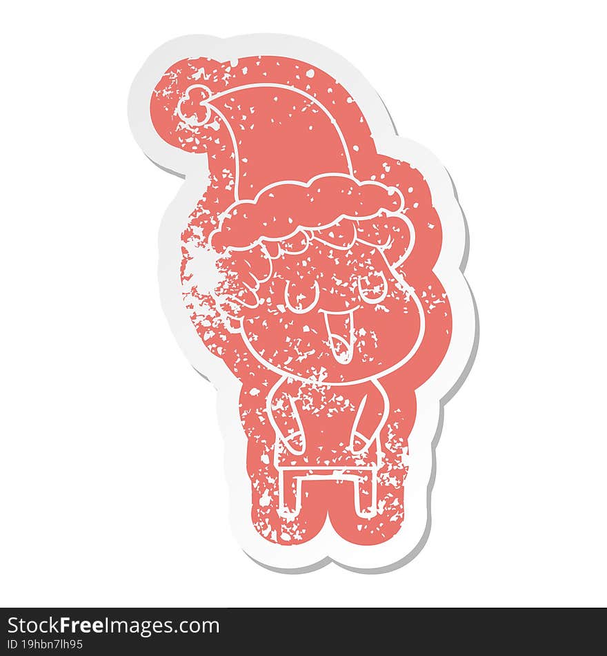 Laughing Cartoon Distressed Sticker Of A Man Wearing Santa Hat