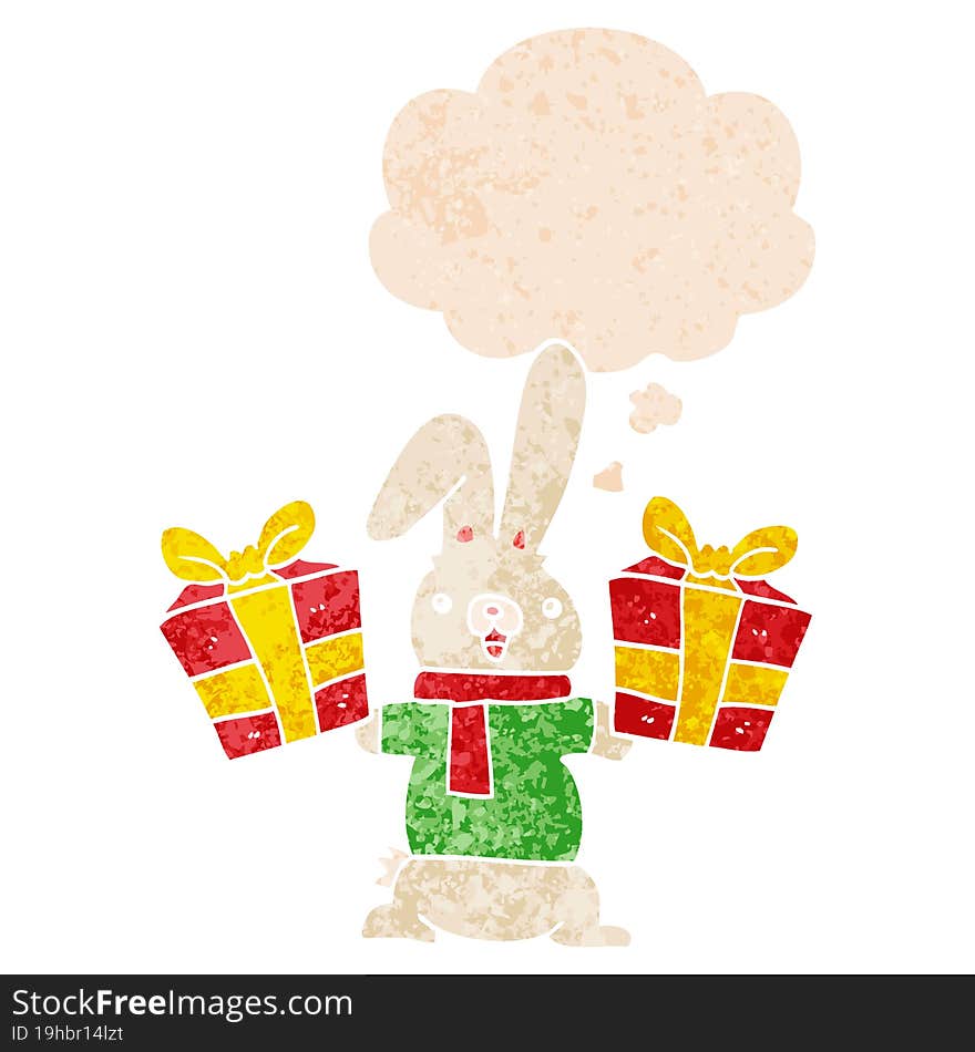 cartoon rabbit with christmas presents with thought bubble in grunge distressed retro textured style. cartoon rabbit with christmas presents with thought bubble in grunge distressed retro textured style