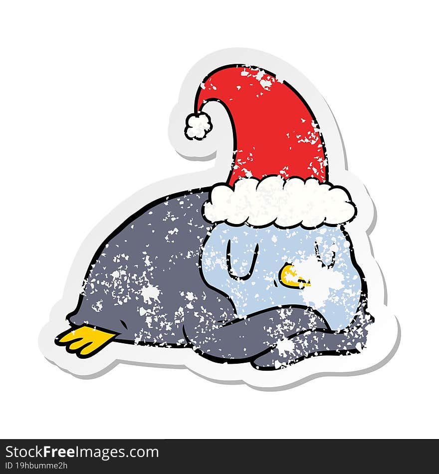 distressed sticker of a cartoon penguin wearing christmas hat