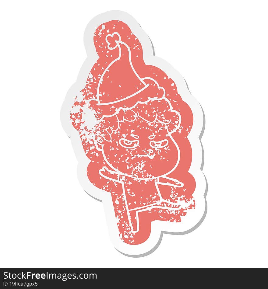 cartoon distressed sticker of a angry man wearing santa hat