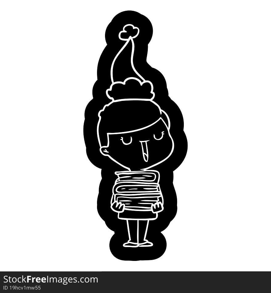 cartoon icon of a happy boy with stack of books wearing santa hat