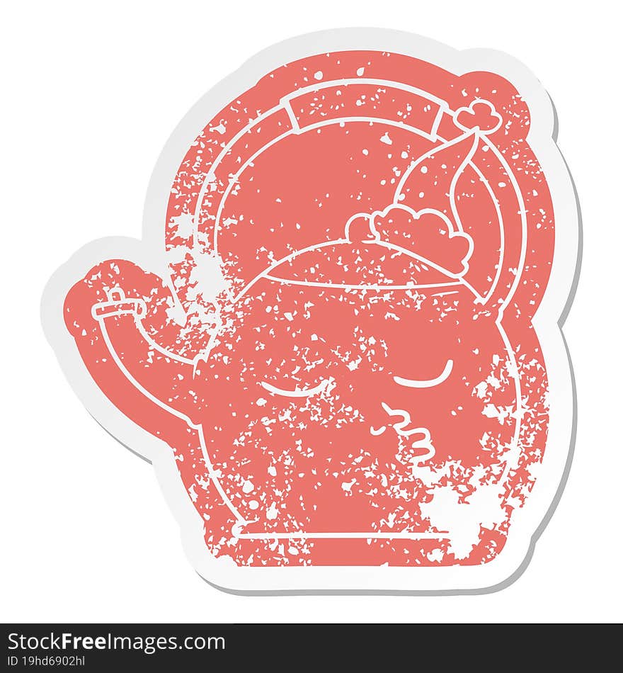 Cartoon Distressed Sticker Of A Kettle Wearing Santa Hat