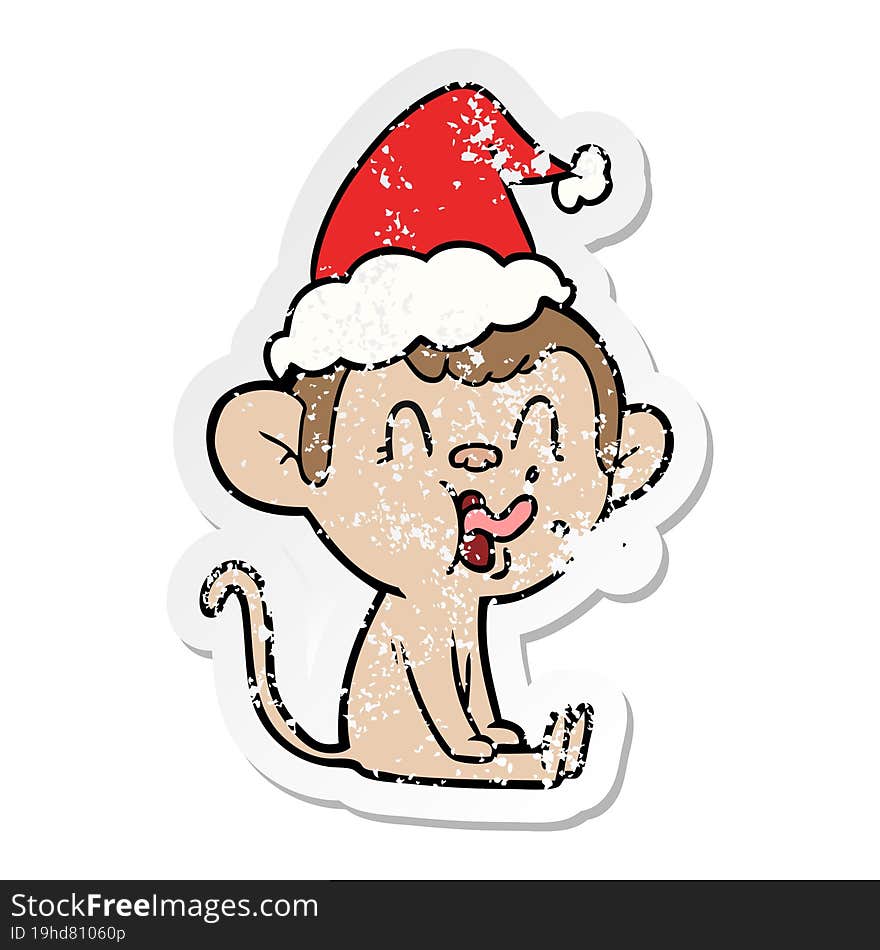 crazy distressed sticker cartoon of a monkey sitting wearing santa hat