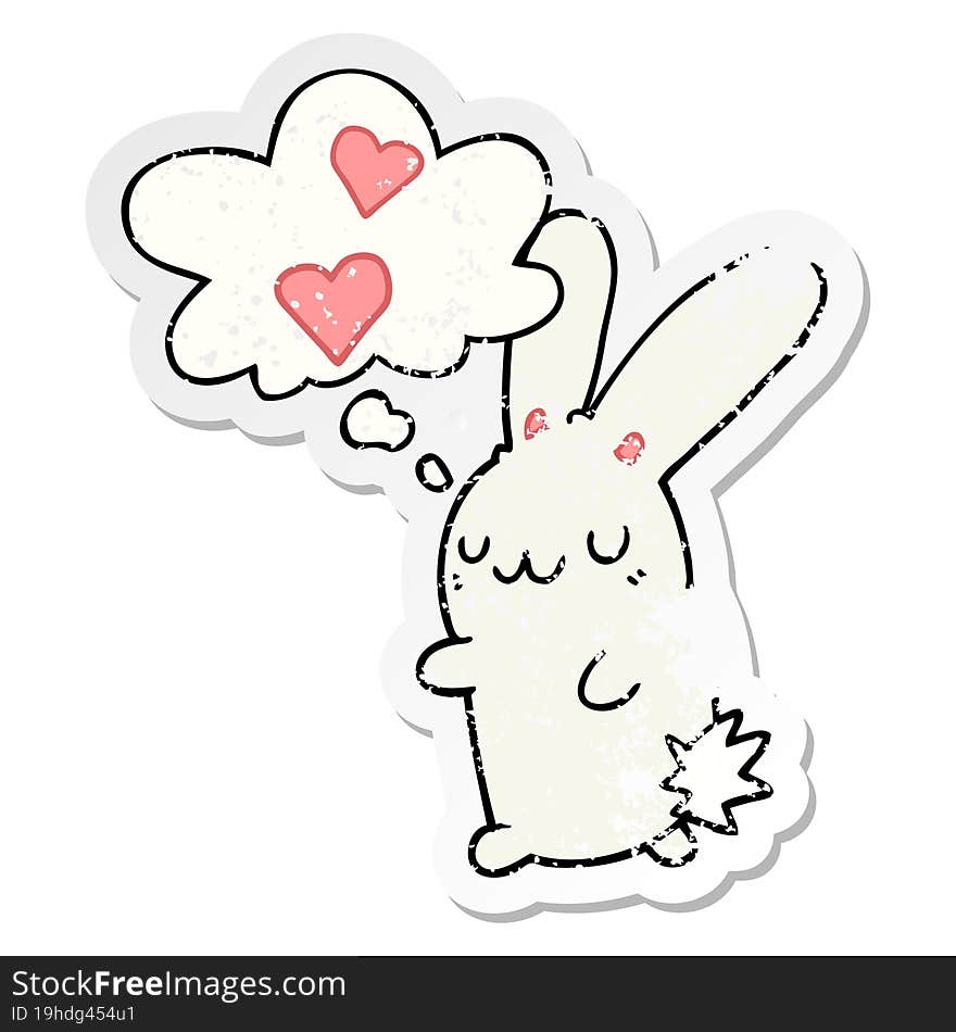 cartoon rabbit in love and thought bubble as a distressed worn sticker