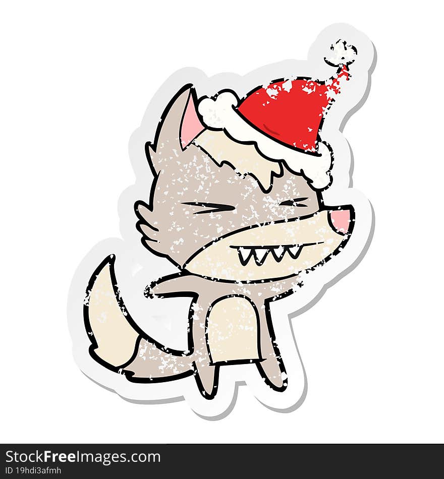 angry wolf distressed sticker cartoon of a wearing santa hat