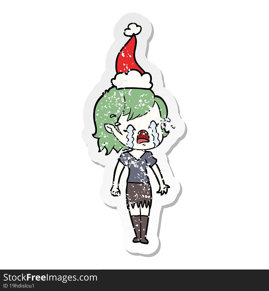 Distressed Sticker Cartoon Of A Crying Vampire Girl Wearing Santa Hat