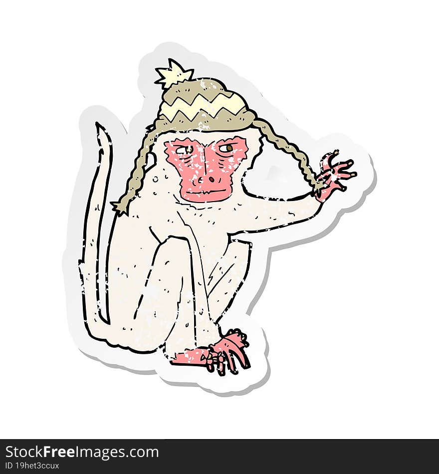 retro distressed sticker of a cartoon monkey wearing hat