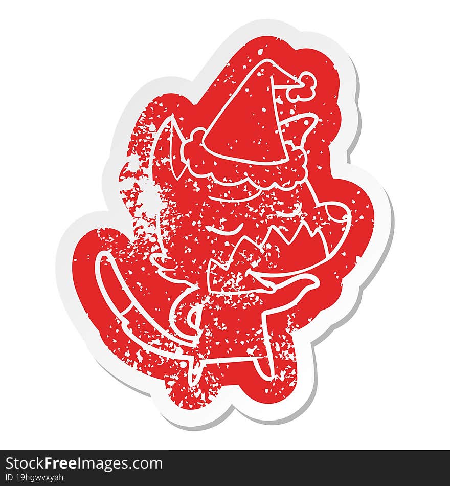 friendly quirky cartoon distressed sticker of a fox wearing santa hat