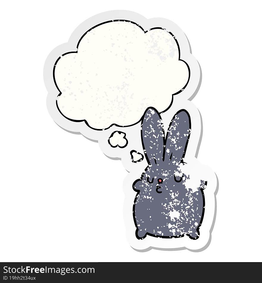 cute cartoon rabbit with thought bubble as a distressed worn sticker