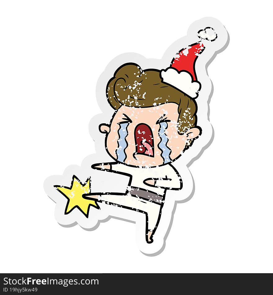 distressed sticker cartoon of a crying man wearing santa hat