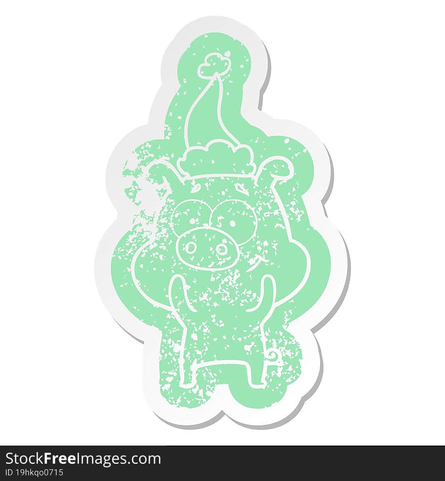 happy cartoon distressed sticker of a pig wearing santa hat