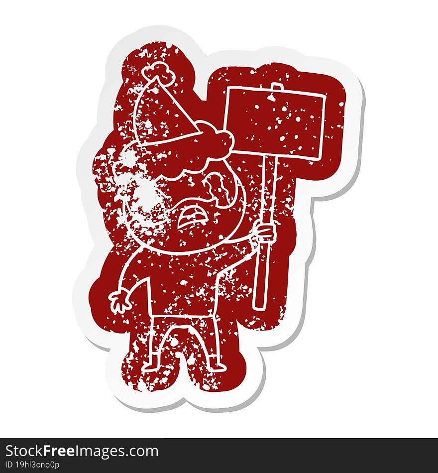 cartoon distressed sticker of a bearded protester crying wearing santa hat