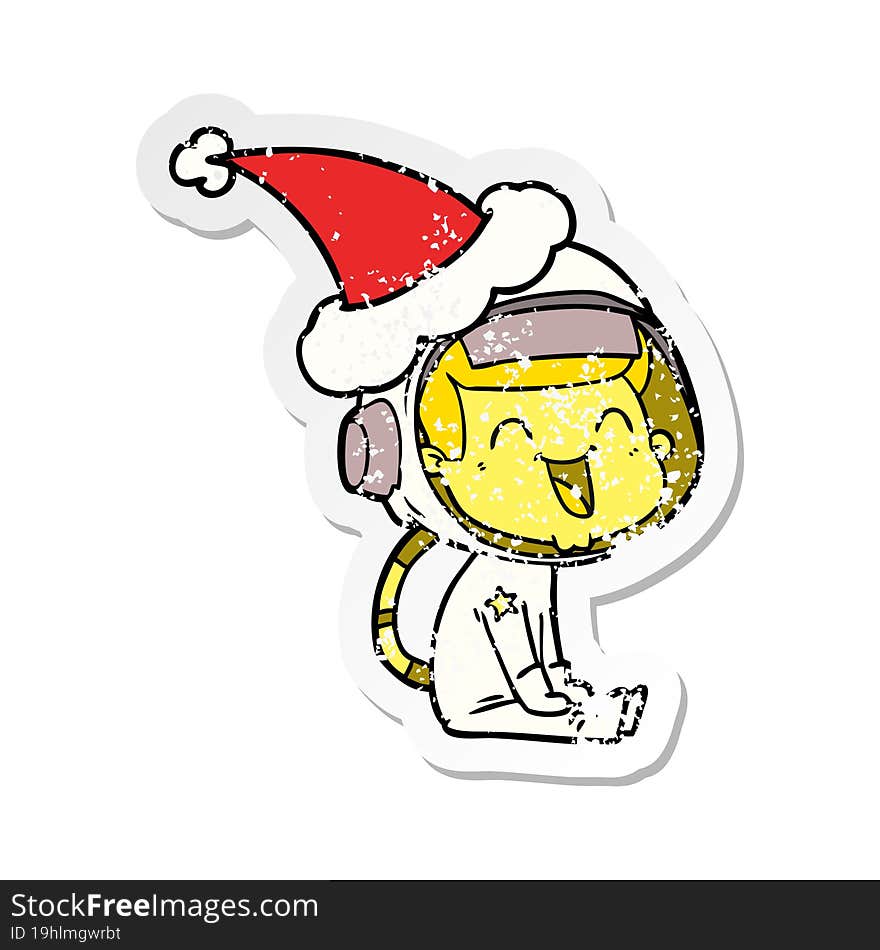 happy hand drawn distressed sticker cartoon of a astronaut wearing santa hat