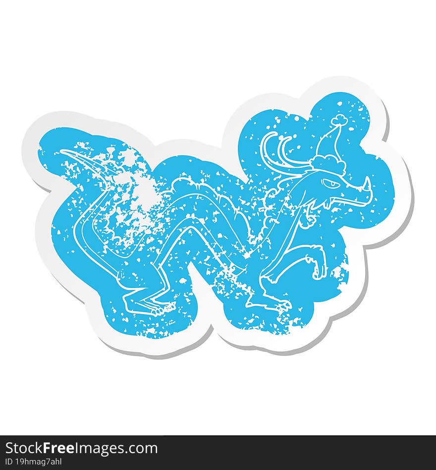 cartoon distressed sticker of a dragon wearing santa hat