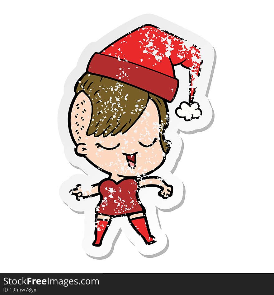 distressed sticker of a happy cartoon girl wearing xmas hat