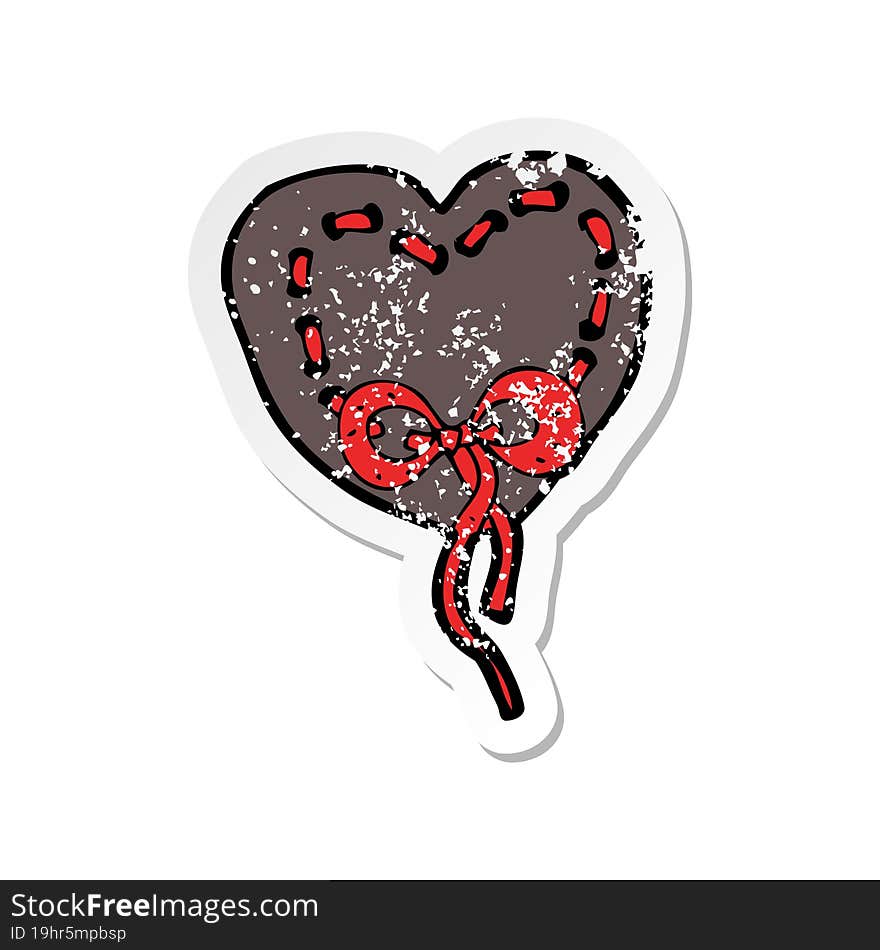 retro distressed sticker of a stitched heart cartoon