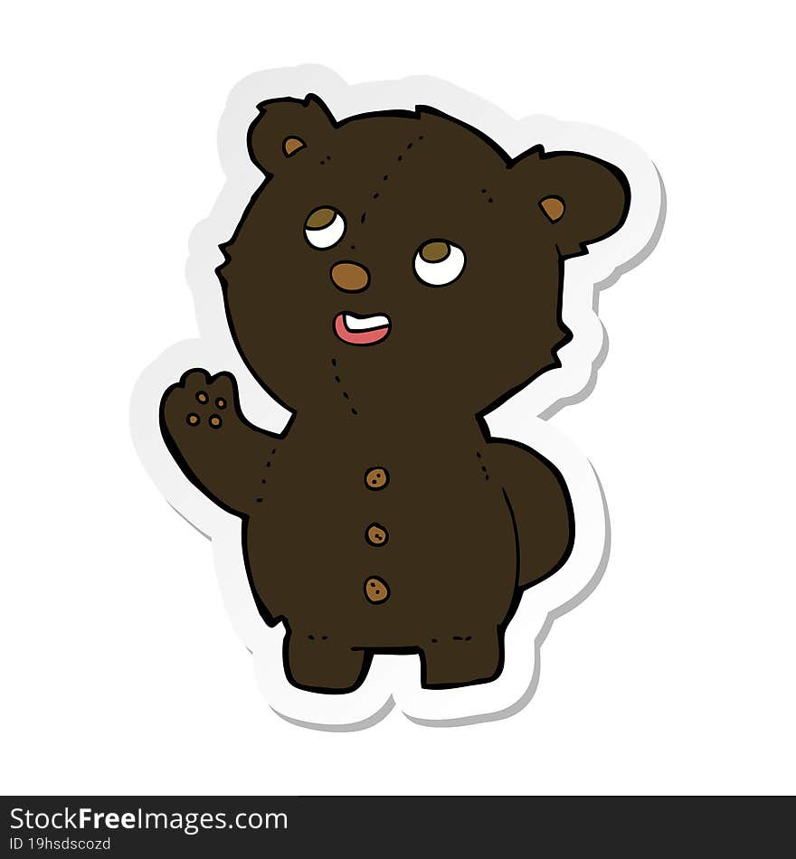 sticker of a cartoon cute black bear cub