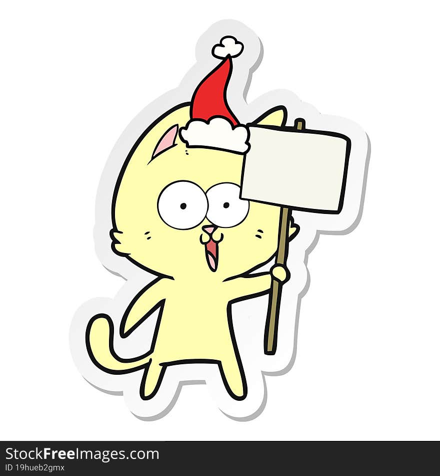 funny sticker cartoon of a cat with sign wearing santa hat