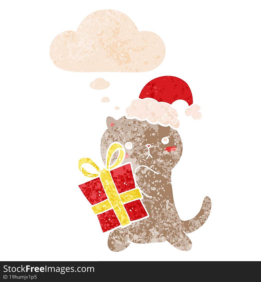 cute cartoon cat carrying christmas present and thought bubble in retro textured style