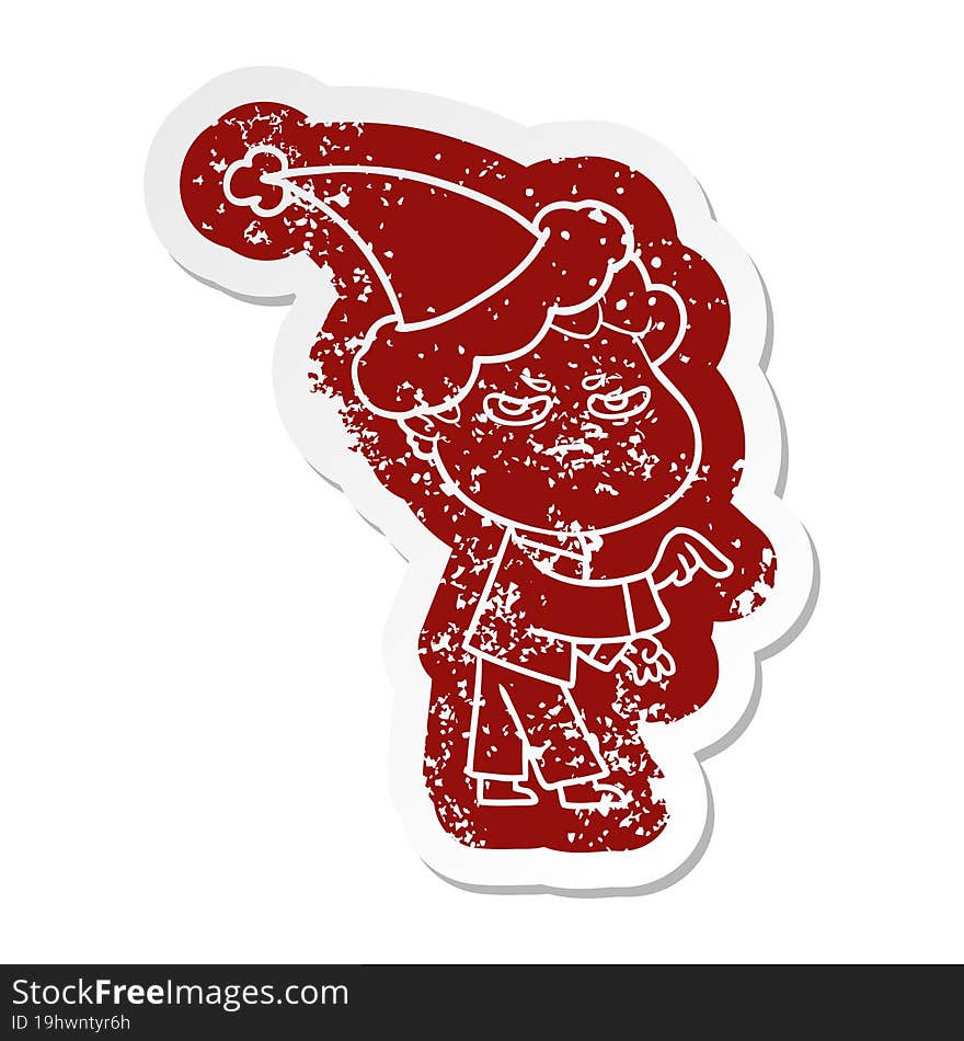 cartoon distressed sticker of a angry man wearing santa hat