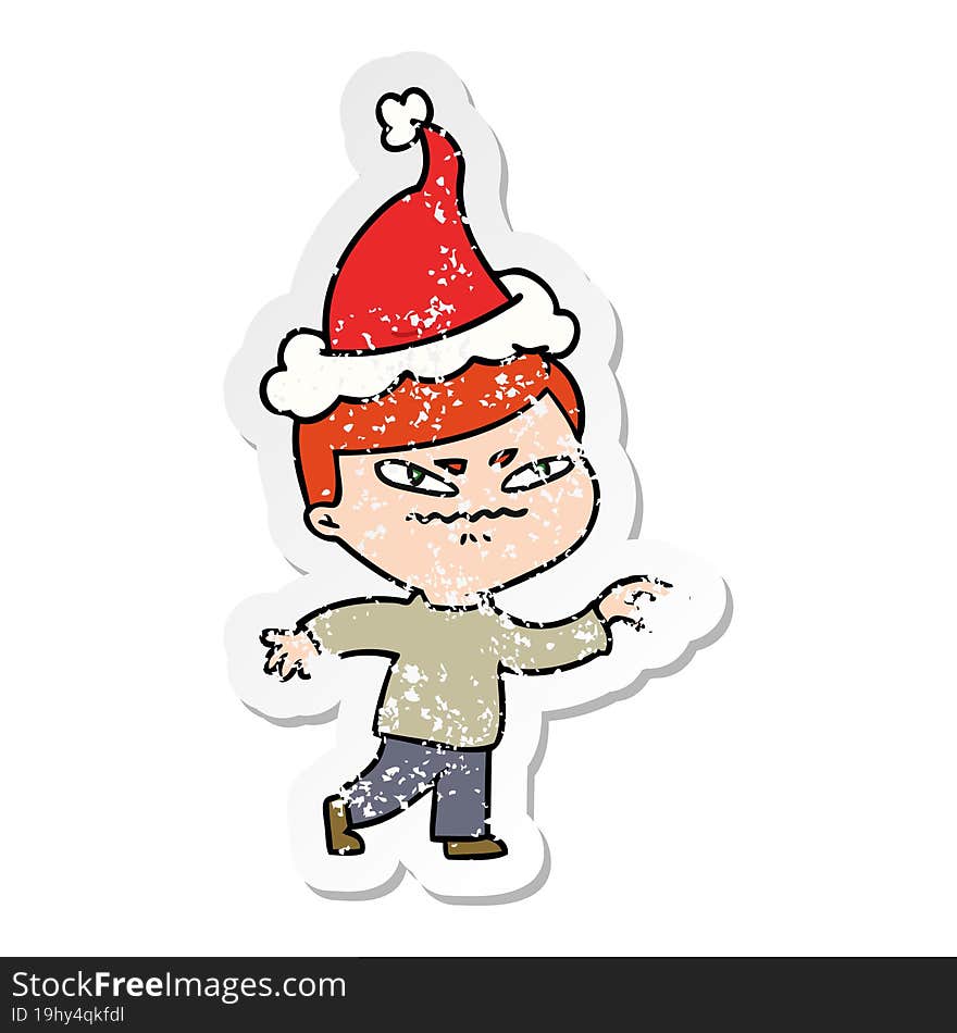 hand drawn distressed sticker cartoon of a angry man pointing wearing santa hat