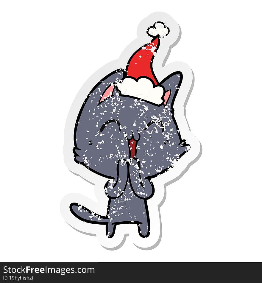 happy distressed sticker cartoon of a cat wearing santa hat