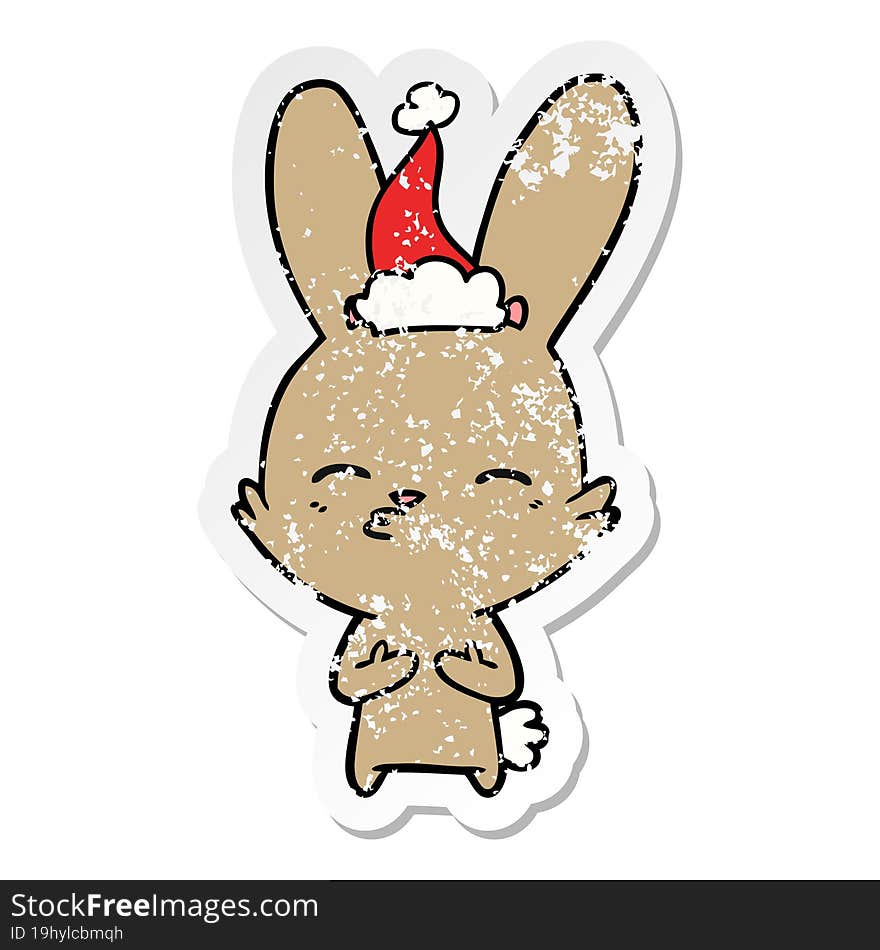 curious bunny distressed sticker cartoon of a wearing santa hat