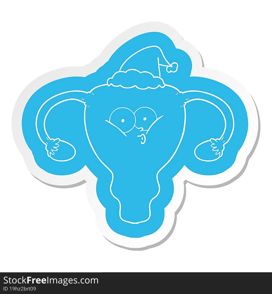 cartoon  sticker of a uterus wearing santa hat