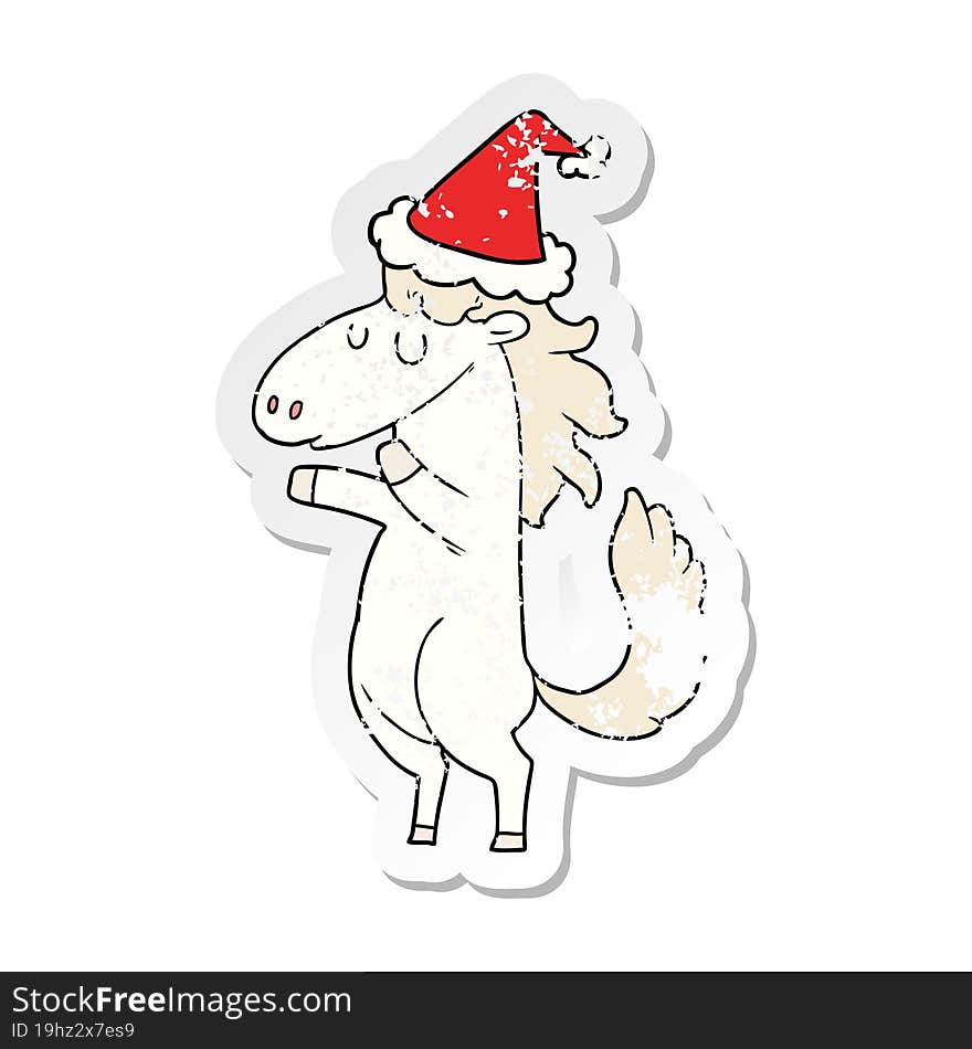 distressed sticker cartoon of a horse wearing santa hat