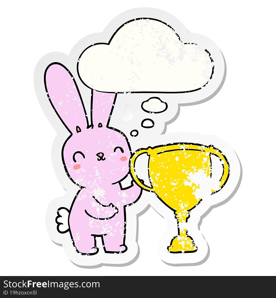 cute cartoon rabbit with sports trophy cup and thought bubble as a distressed worn sticker