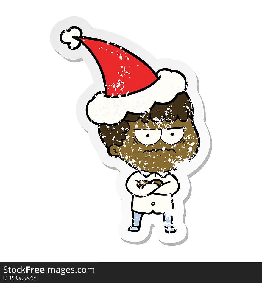 distressed sticker cartoon of an annoyed man wearing santa hat