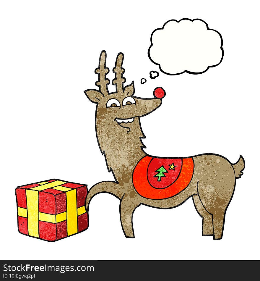 freehand drawn thought bubble textured cartoon christmas reindeer with present