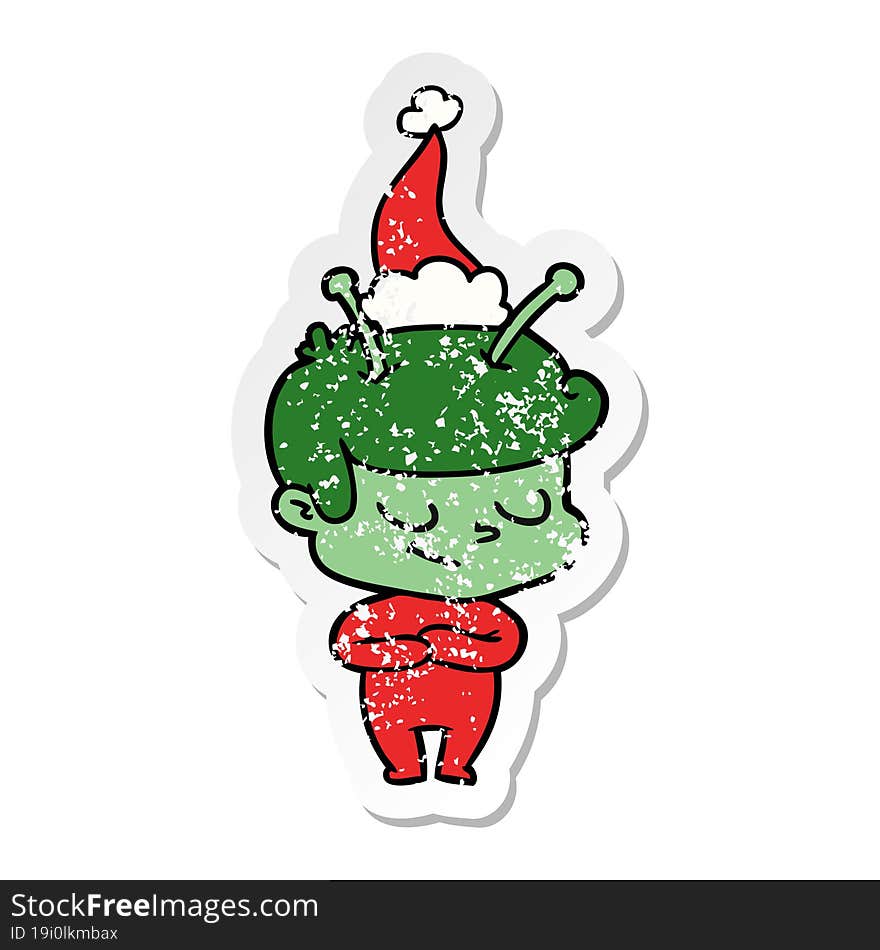 Friendly Distressed Sticker Cartoon Of A Spaceman Wearing Santa Hat