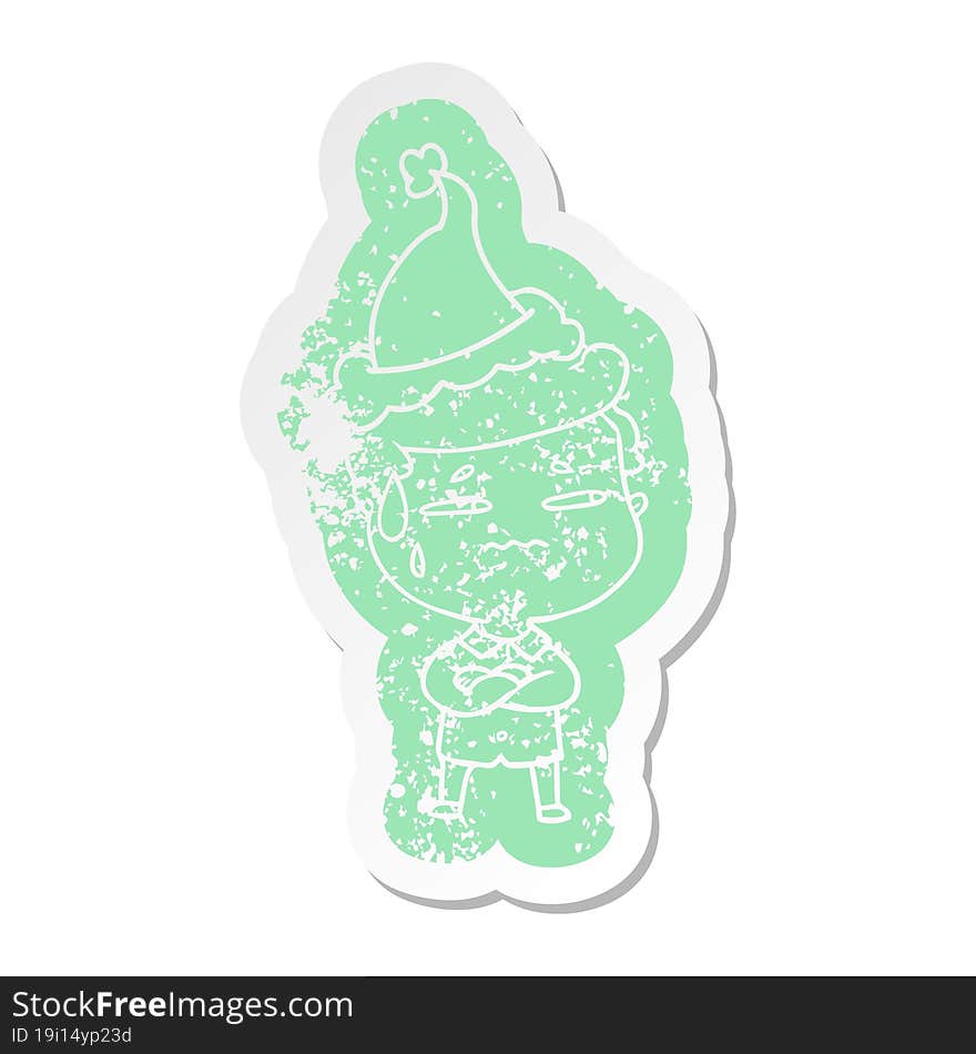 cartoon distressed sticker of a anxious man wearing santa hat