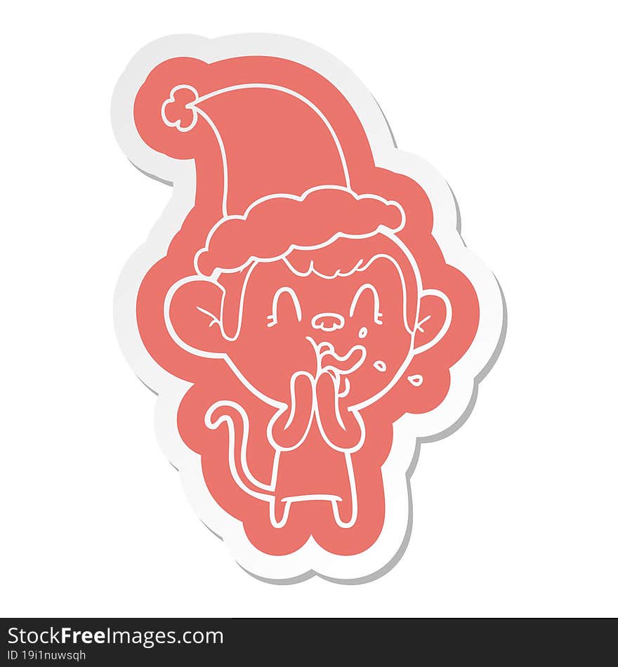 crazy cartoon  sticker of a monkey wearing santa hat