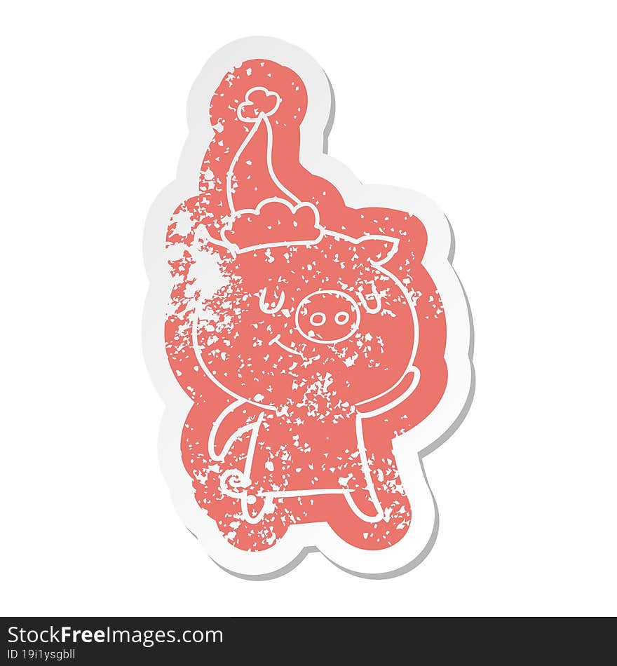 happy cartoon distressed sticker of a pig wearing santa hat