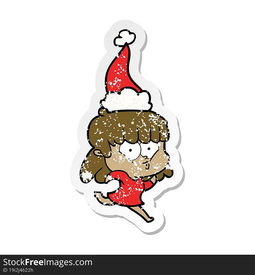 distressed sticker cartoon of a whistling girl wearing santa hat