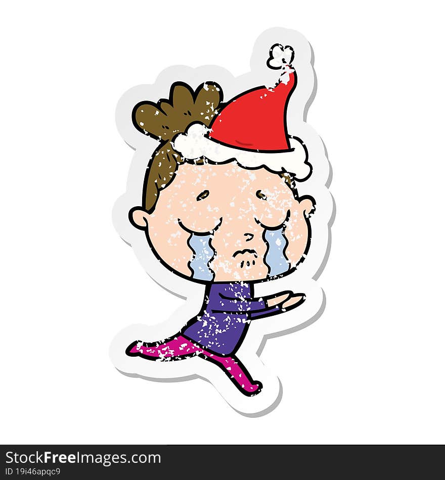 Distressed Sticker Cartoon Of A Crying Woman Wearing Santa Hat