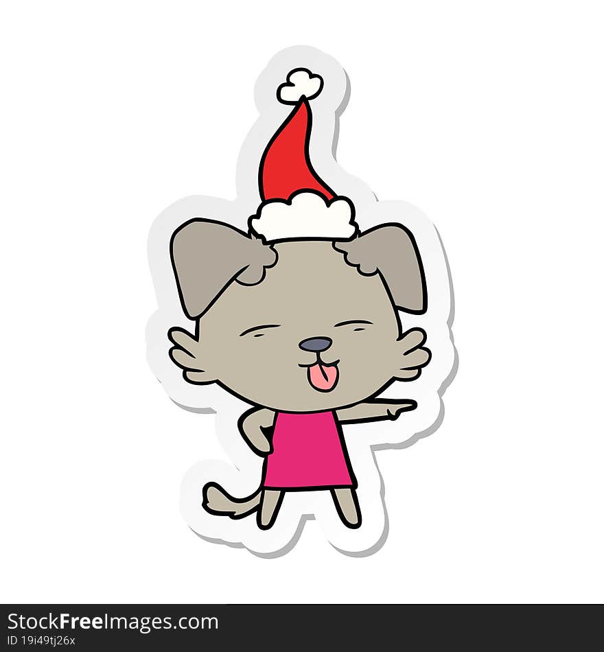 sticker cartoon of a dog sticking out tongue wearing santa hat