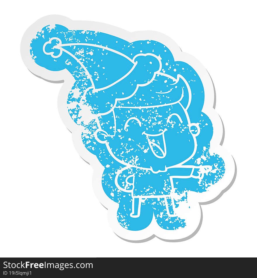 Cartoon Distressed Sticker Of A Man Laughing Wearing Santa Hat