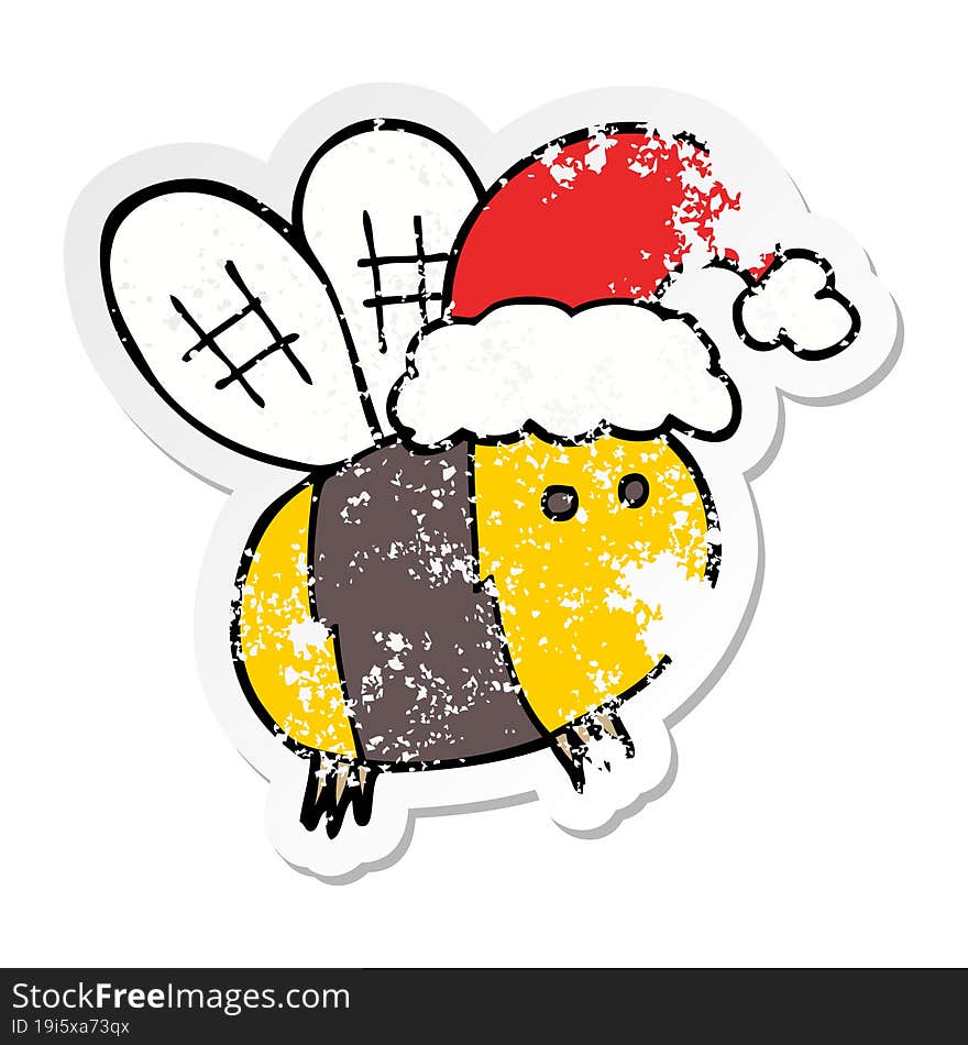 distressed sticker of a cute cartoon bee wearing christmas hat