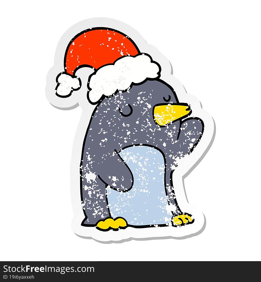 distressed sticker of a cute cartoon christmas penguin