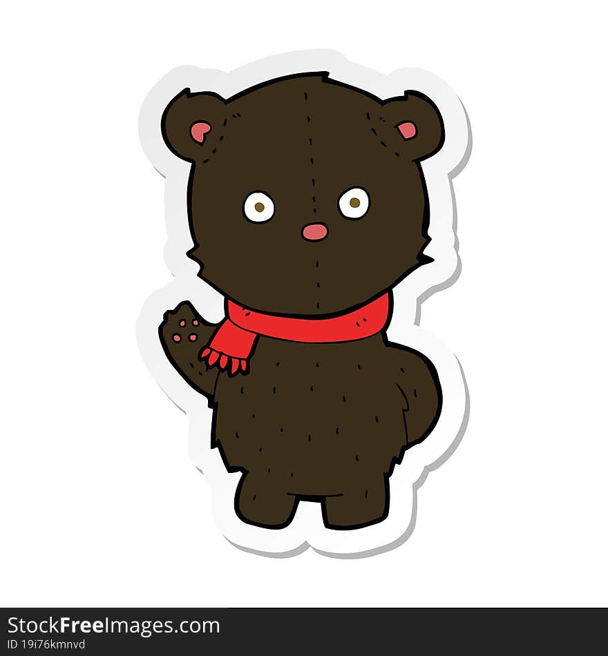 sticker of a cartoon waving black bear cub