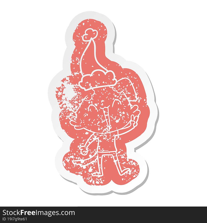 happy little dog cartoon distressed sticker of a wearing santa hat