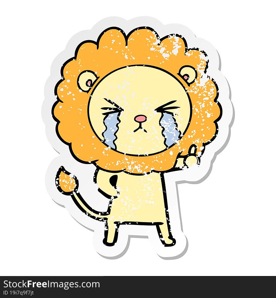 distressed sticker of a cartoon crying lion