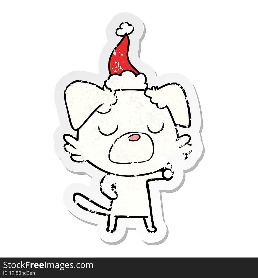 distressed sticker cartoon of a dog wearing santa hat