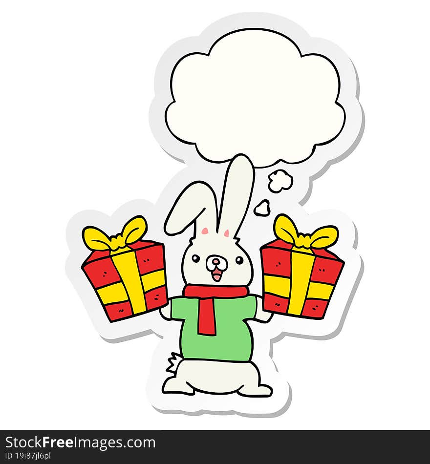 cartoon rabbit with christmas presents and thought bubble as a printed sticker