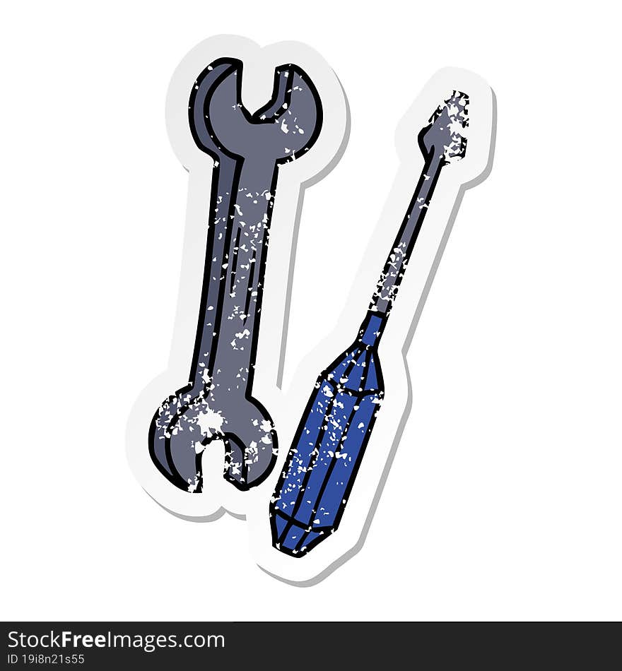 distressed sticker cartoon doodle of a spanner and a screwdriver