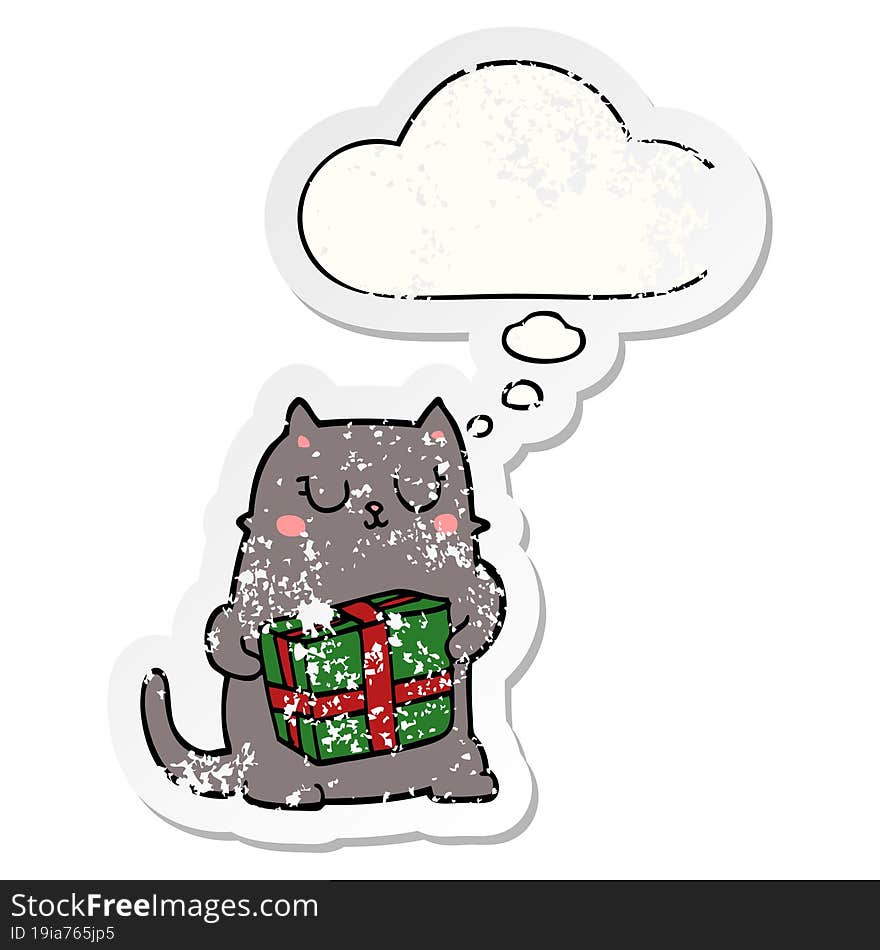 cartoon christmas cat and thought bubble as a distressed worn sticker